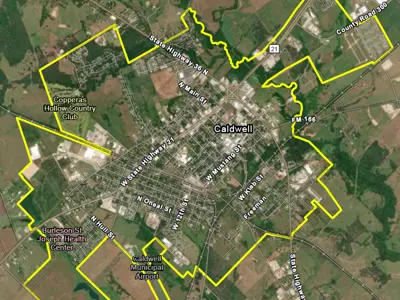 an aerial map with a yellow line outlining the city limits